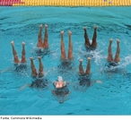 Imagem de uma presentação de quatro atletas do Nado Sincronizado.  <br> <br>  Palavras-chave: esporte, nado sincronizado, natação.